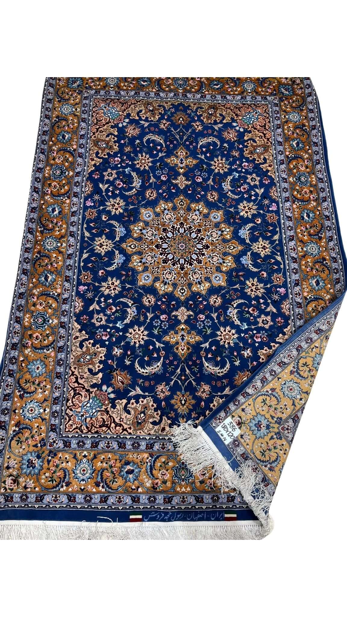 "Hand-knotted Persian rug made with wool and silk by master weaver Hojehfroosh."